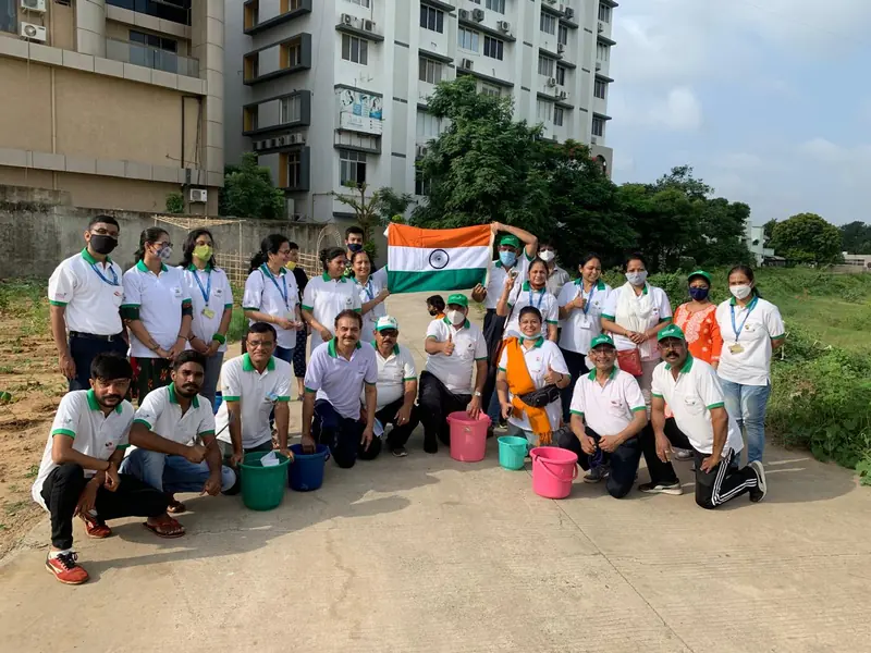 CATCH Foundation volunteers holding the Indian flag at a tree plantation drive